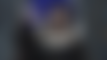 The image shows a piece of The Royal Rogue's cover, which displays the prince holding up a mysterious copper necklace.