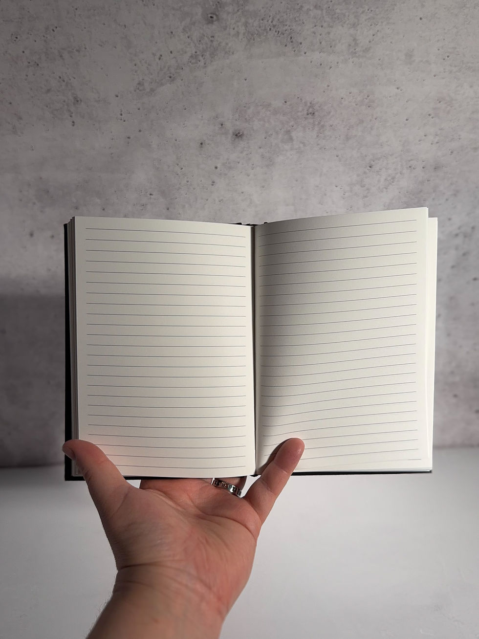 Thumbnail: The Grimoire Notebook In Hand
