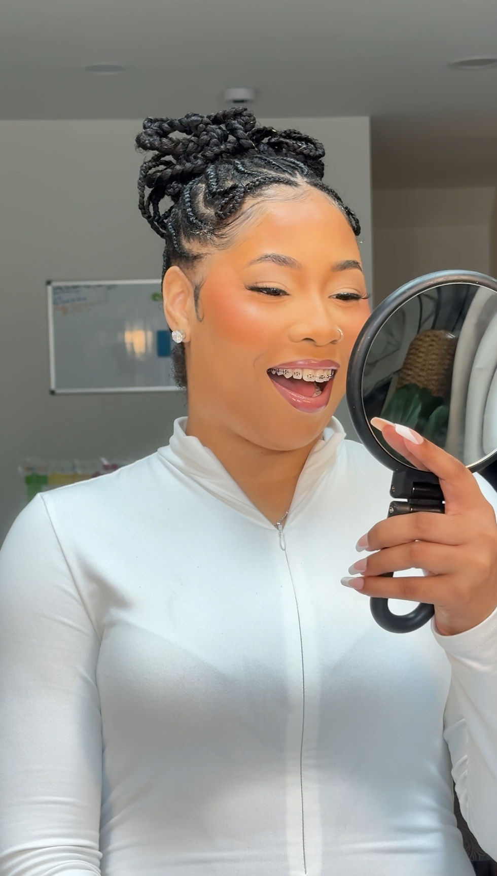 Bride reviewing her finished look at a bridal makeup trial with a New Jersey bridal makeup artist