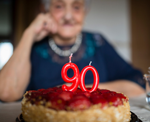 senior with birthday cake