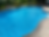 Inground swimming pool image with clear water.