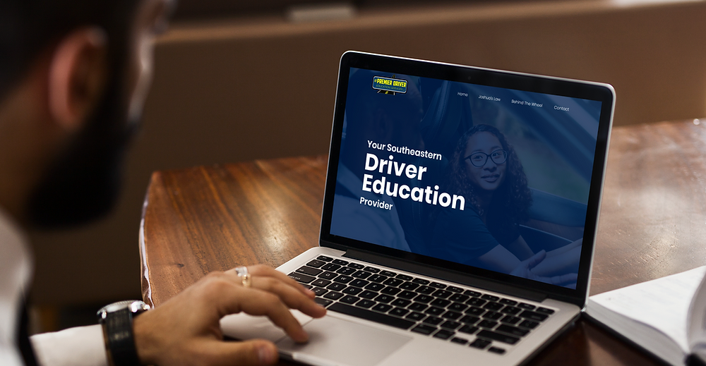 mockup-featuring-a-man-using-his-macbook-pro-on-a-wooden-desk-2321-el1.png.webp
