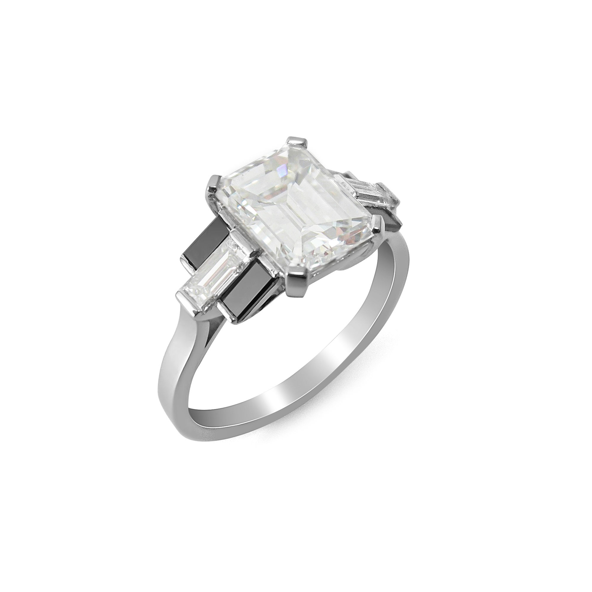 Emerald cut diamond ring with black and white diamond baguette shoulders