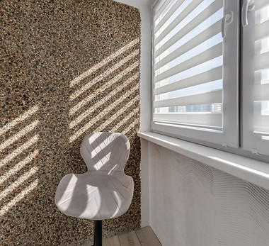 Modern double roller zebra blinds on large windows in bright minimalist interior with sunl