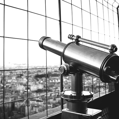 silver telescope near fence_edited.jpg