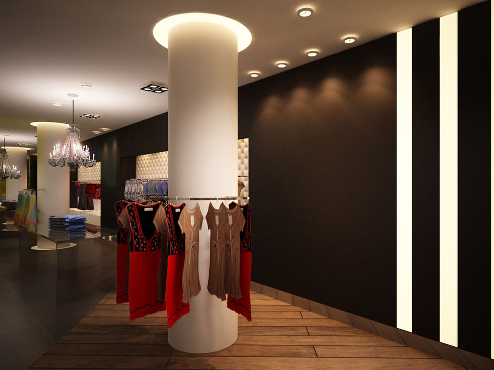 Interior de loja com araras de roupas em coluna central
