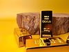 close-up-shot-of-gold-bars-next-to-a-wooden-piece-2025-02-02-13-47-39-utc.jpg