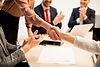business-people-shaking-hands-finishing-up-a-meet-2025-02-21-03-11-01-utc.jpg
