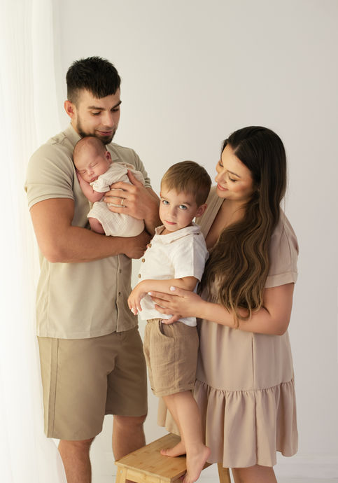 Family portrait with a newborn baby