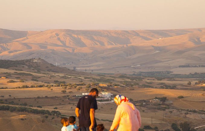 Family having a view of the beautiful landscapes of Morocco, close to Draa Valley and the Atlas Mountains.