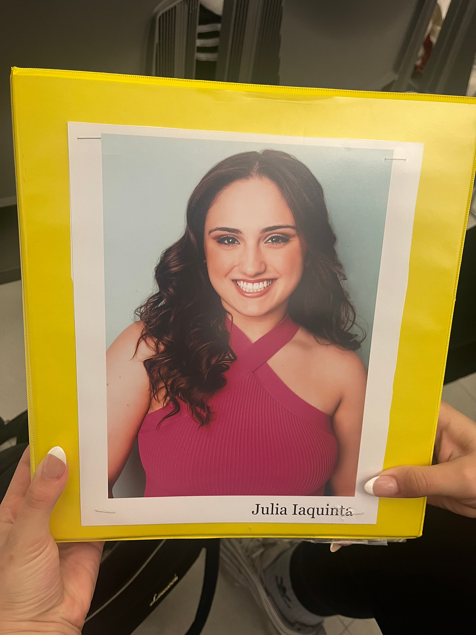 Julia Iaquinta's headshot being held in an audition holding room