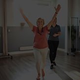 A happy patient standing or walking conf