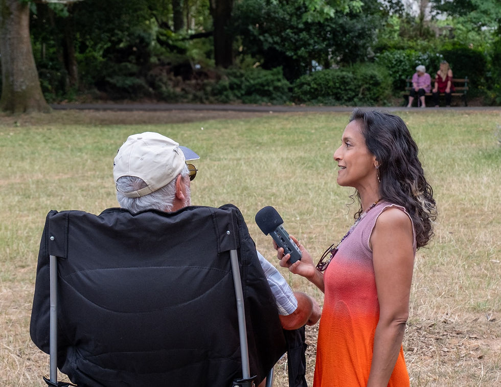 Sonia Interviewing a Man who Travelled 220 Miles to See His Granddaughter Play in the Frome Town Ban
