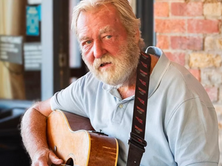 Paul Kirtley playing guitar in Frome