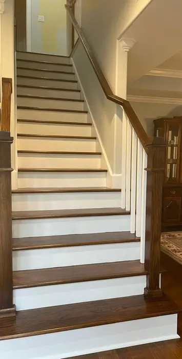 Staircase with dark wood treads and white risers