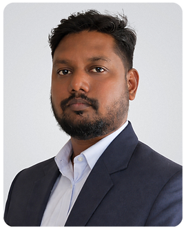 Man in dark suit looking forward