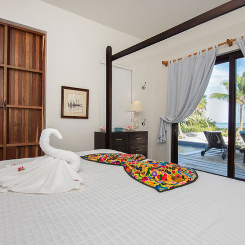 Downstairs Master with King. Walk out to the deck, pool & beach.