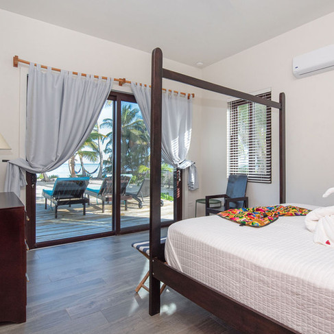 Downstairs Master with King. Walk out to the deck, pool & beach.