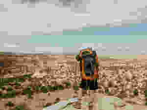 The view of a backpacker on a backpacking trip n the Black Ridge Canyons Wilderness area in Colorado on a blue sky day.