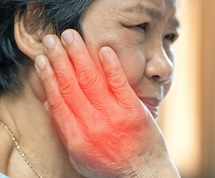 Old Asia woman hand on cheek face as suffering from facial pain