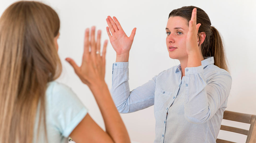 woman-teaching-other-woman-sign-language.jpg