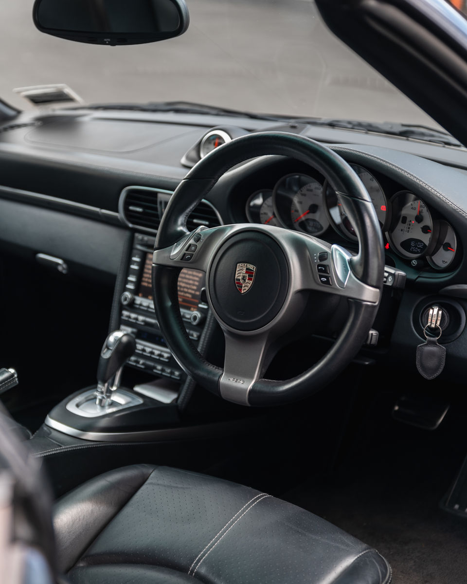 Detailed black leather car interior.