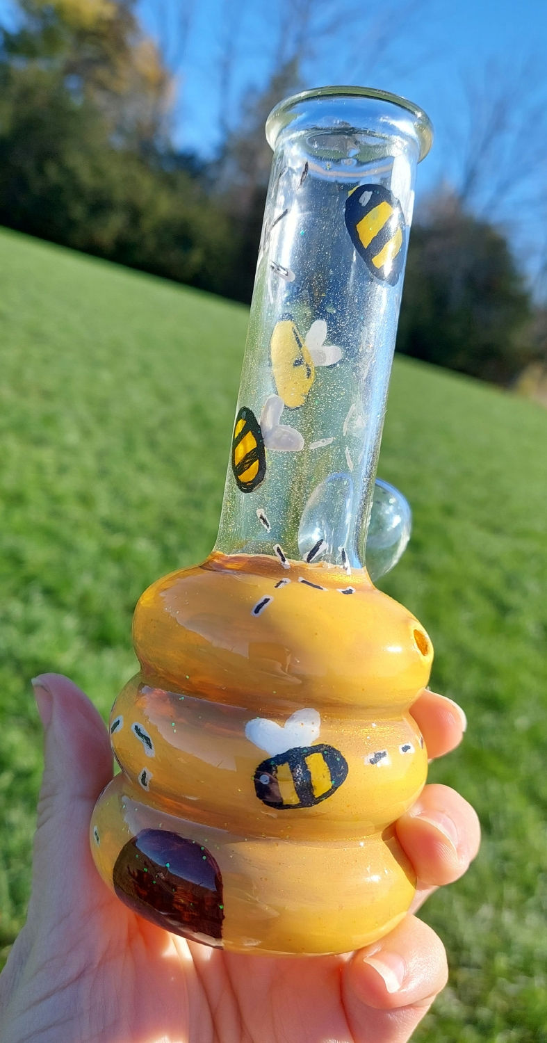 Thumbnail: Alternate view of the Bee Hive 6" mini vase with grassy background. 