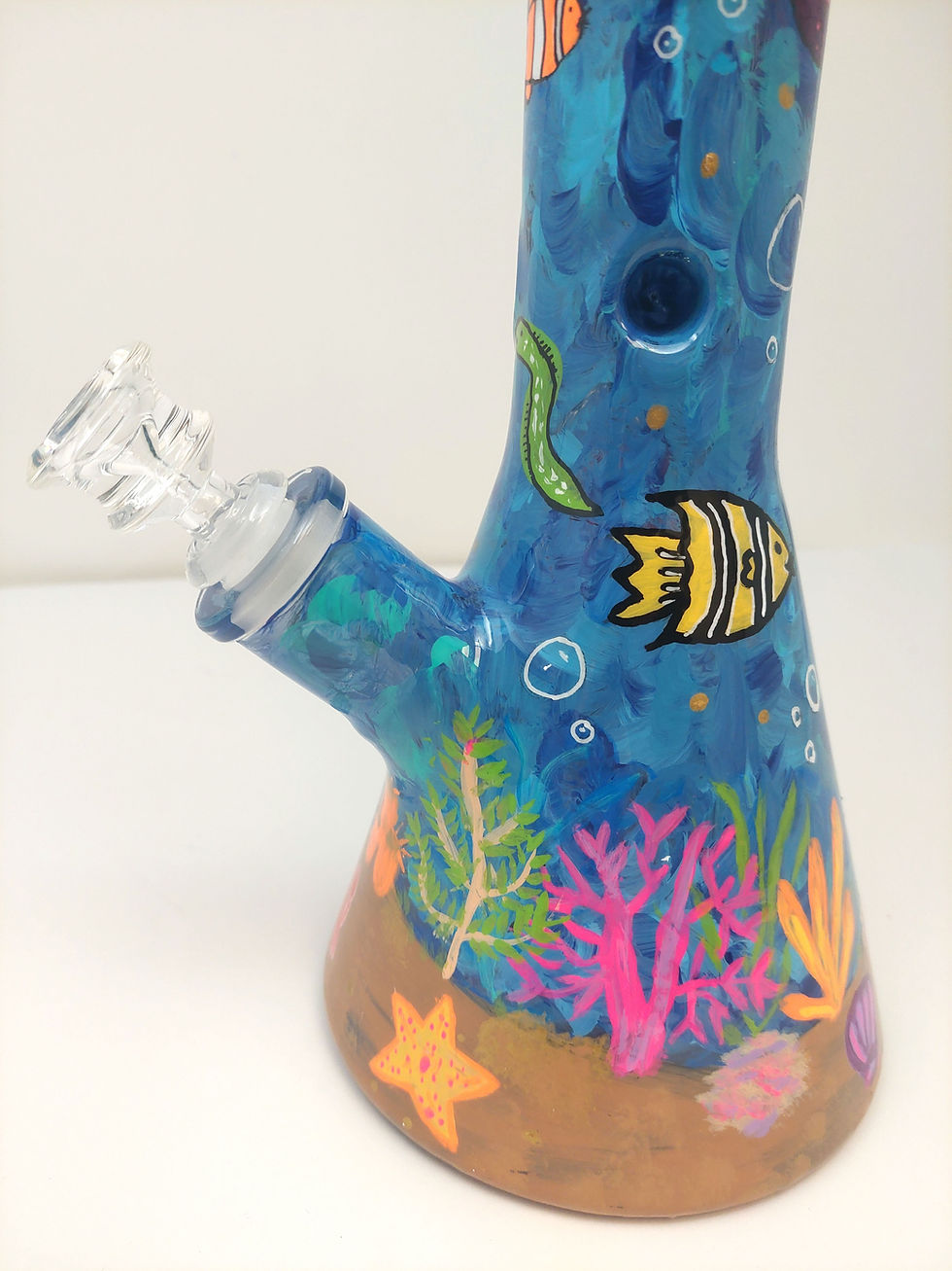 Thumbnail: Close up view of paintings of corals and fish that also glow under black light on "Under the Sea" Bong.
