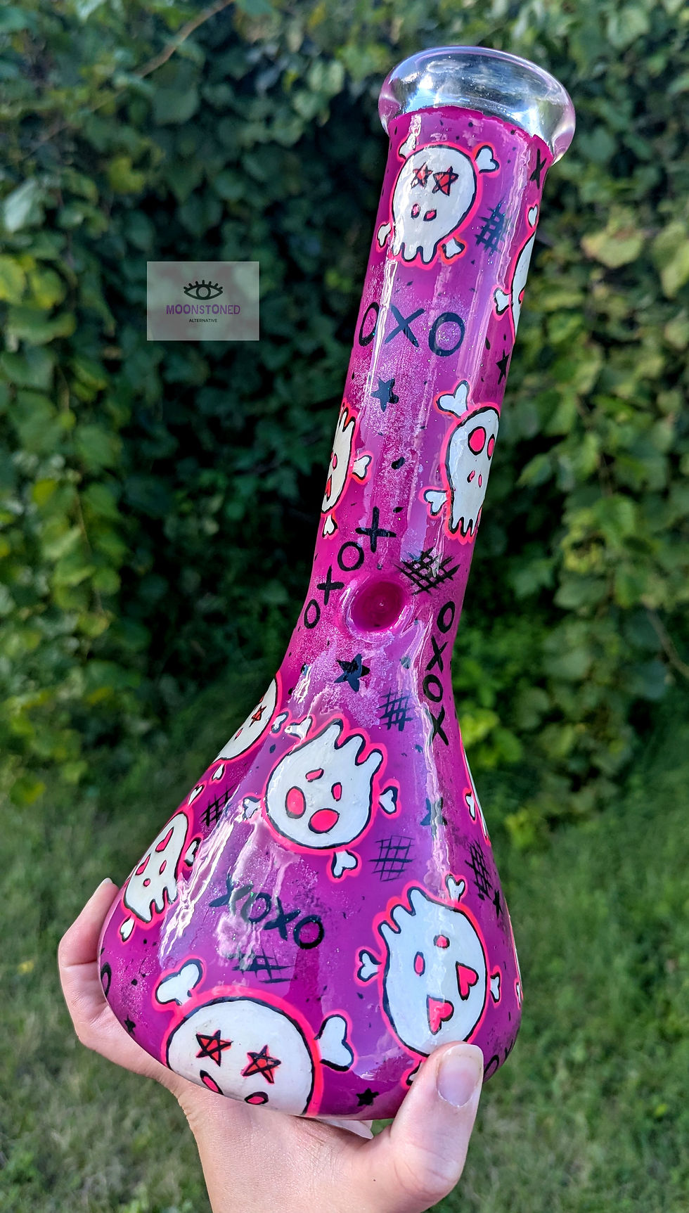 Main view of the Y2K Punk Princess Hand-painted Bong in natural lighting with greenery in background