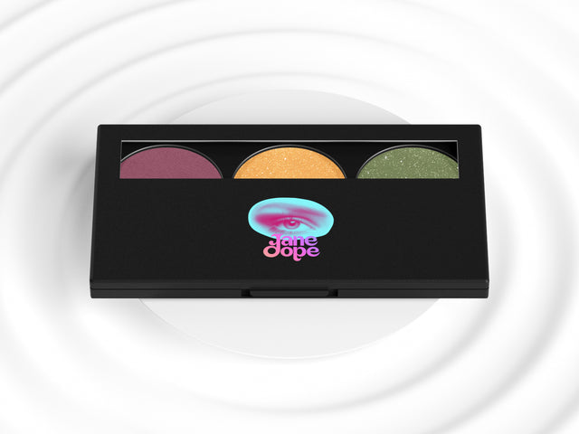 sativa bliss eye shadow pallet is inspired by sativa strains. features a green, pink and yellow pallet in a black makeup compact