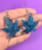 Sizing view of the large sativa "Blue Gelato" inspired weed leaf earrings