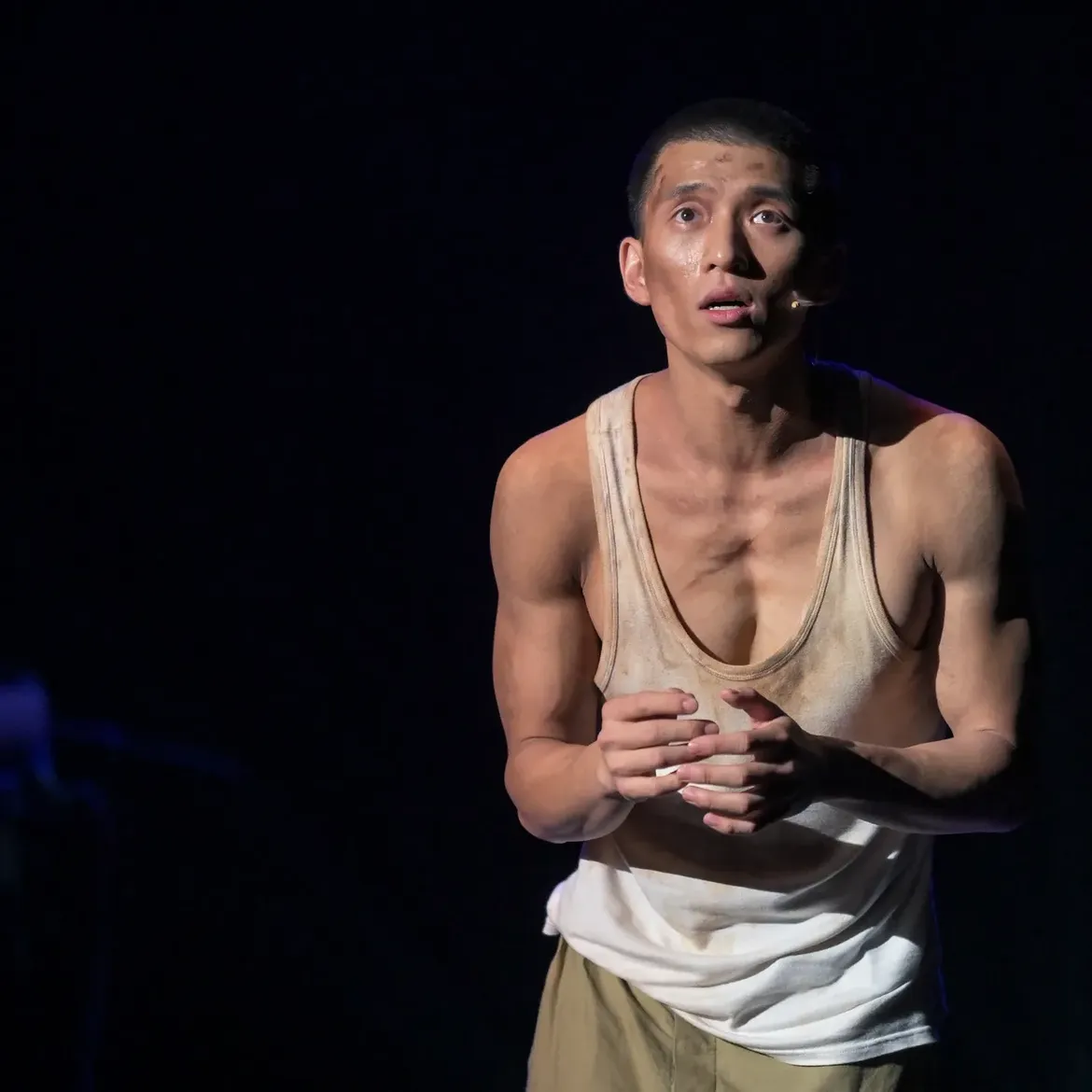 Close-up of Terrence Leung performing in Grave of the Fireflies