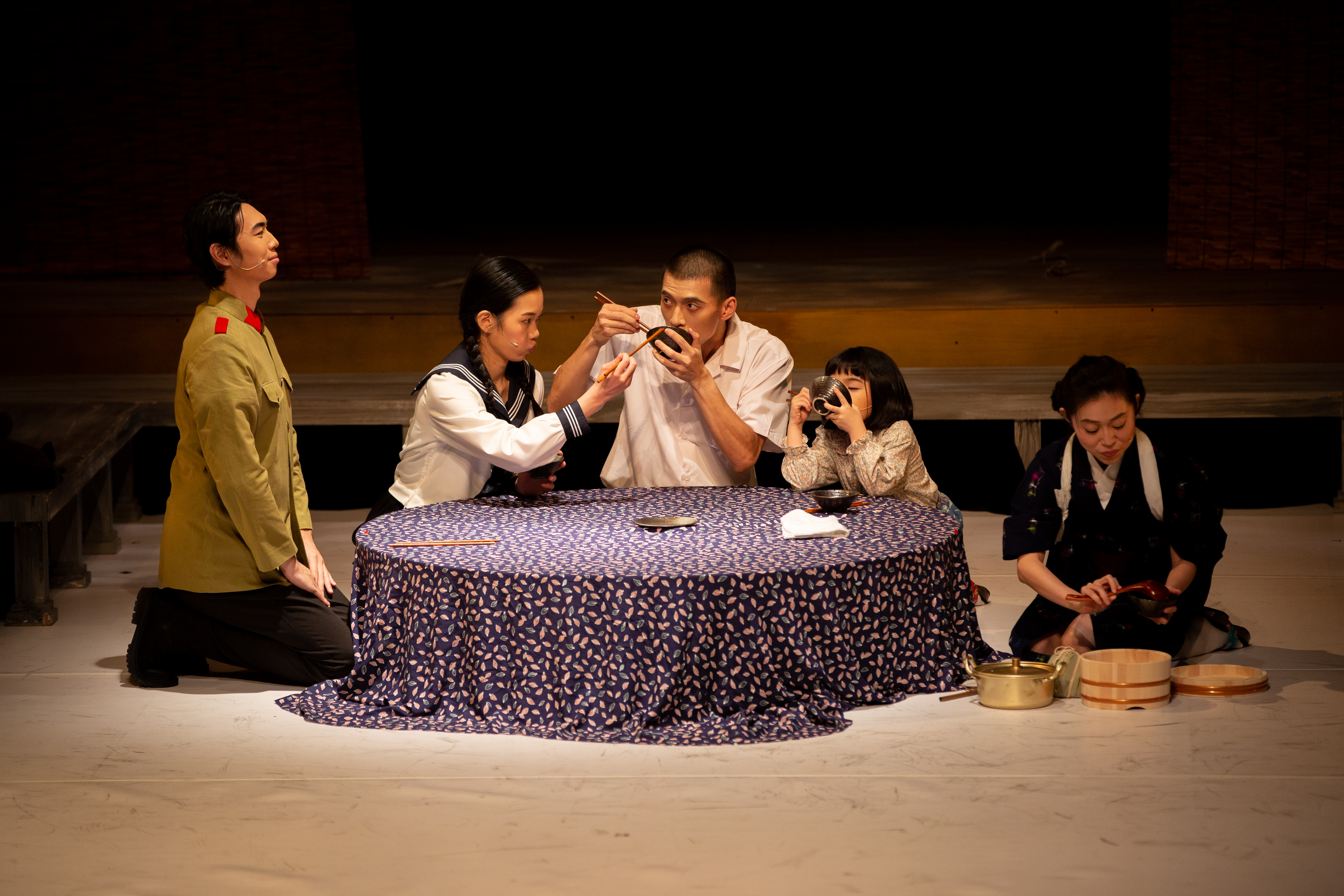The cast of Grave of the Fireflies gathered around a table