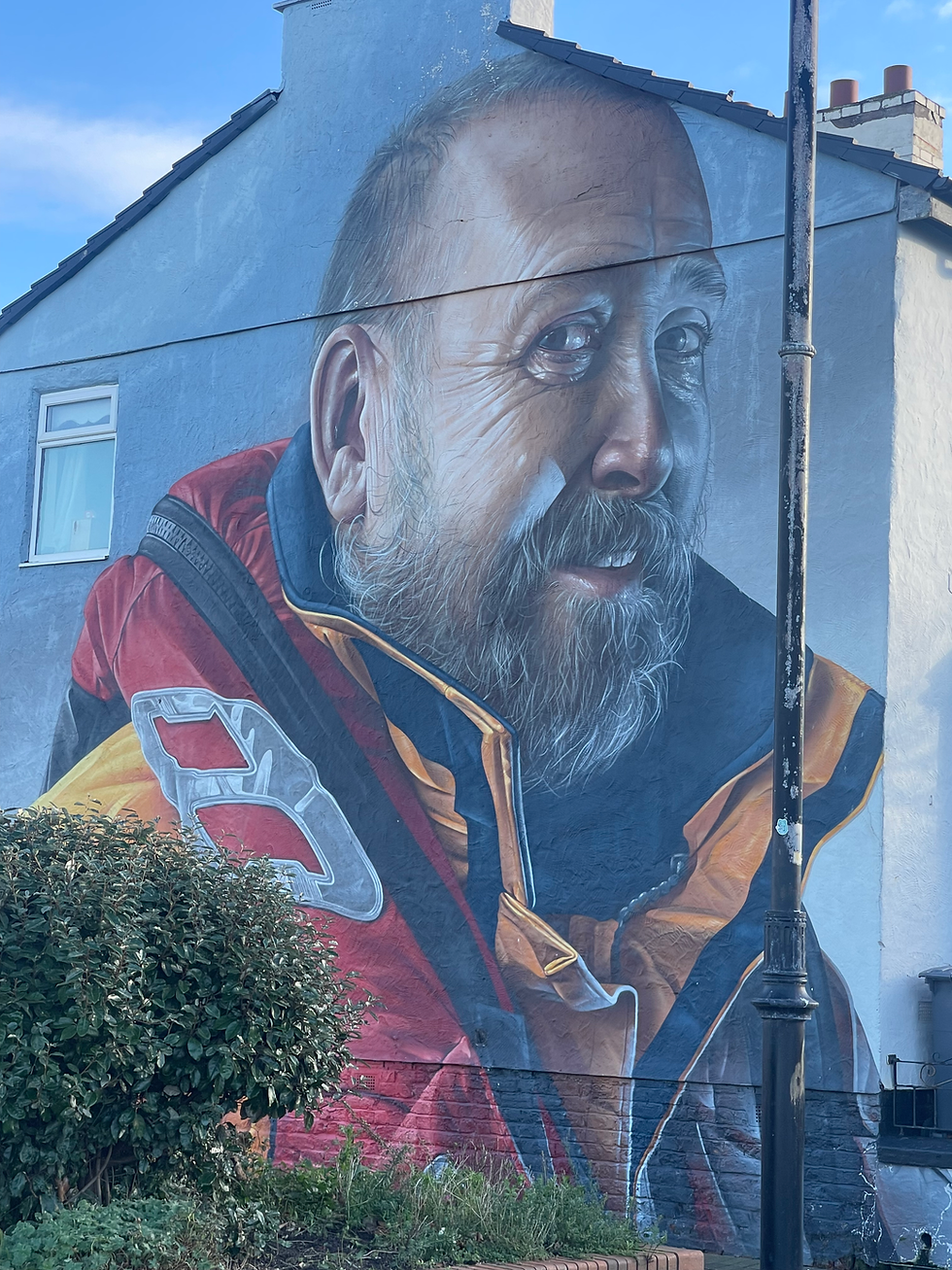 A mural of an RNLI lifeguard in Liverpool.