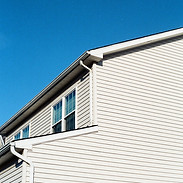 white wooden house under blue sky during