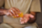 Man taking pain pills