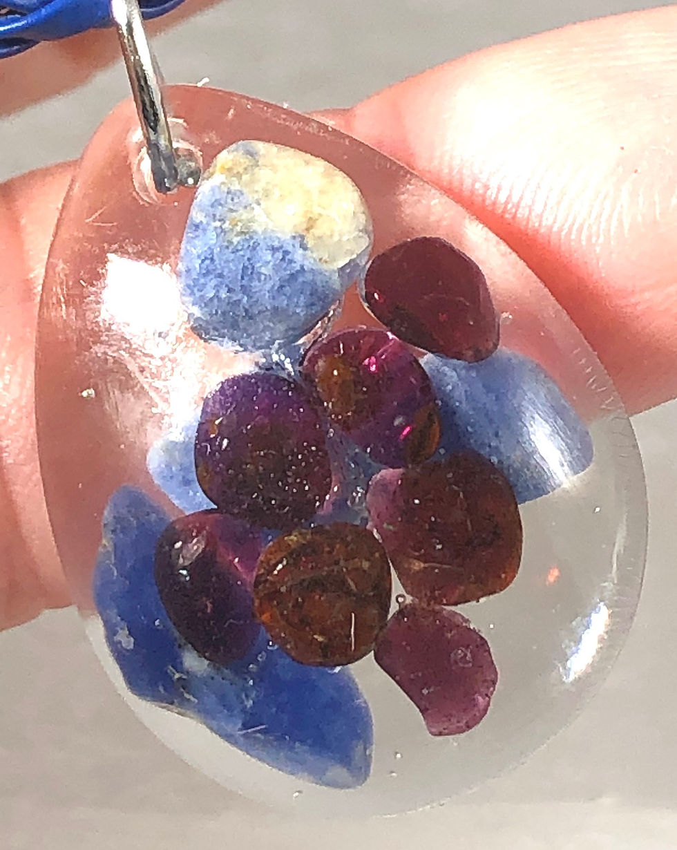 Thumbnail: Garnet and Lapis Lazuli set in resin on 16-18” woven cord