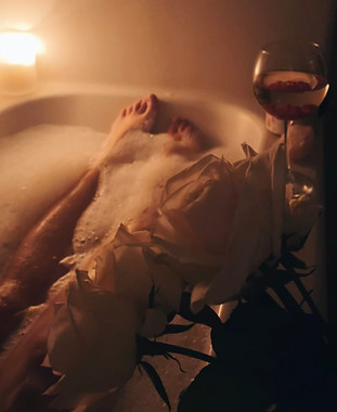 Dr. Aleks practicing feminine embodiment through ritual bath time and intentional slowing down for nervous system regulation