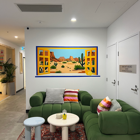 Desert scene mural framed like a window in WOTSO Kogarah’s reception area.