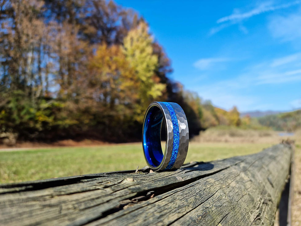 Thumbnail: Himeros Kratos Cock Ring on a wooden log
