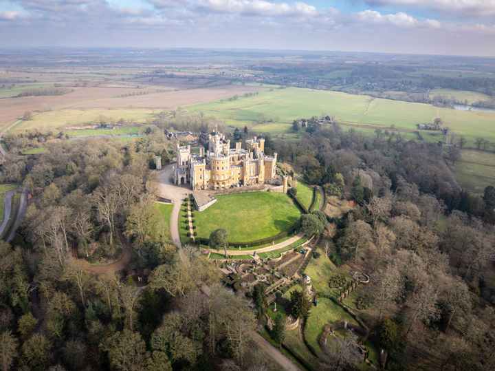 Aerial view of a fairytale castle on a hill