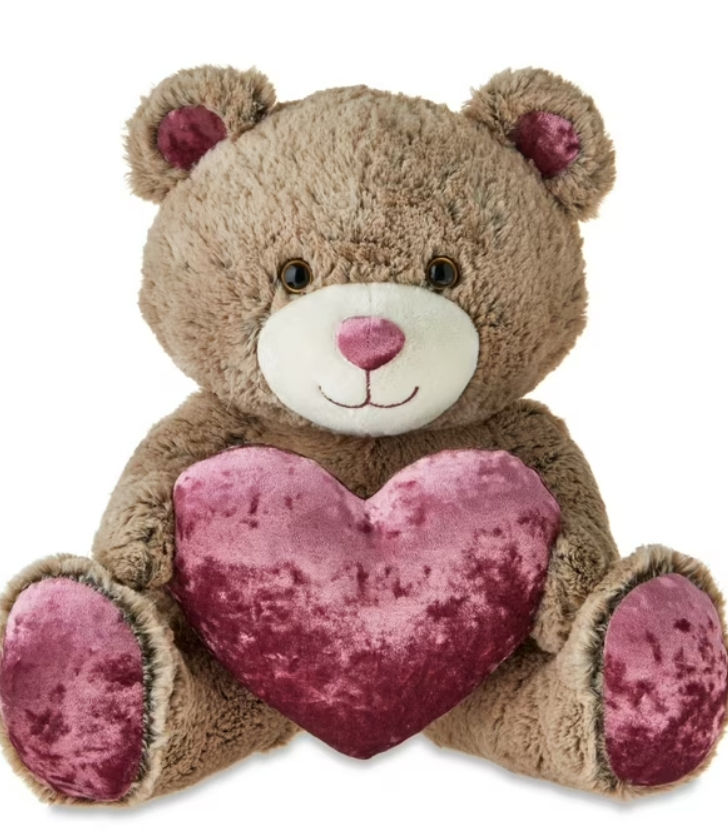 brown teddy bear with pink heart