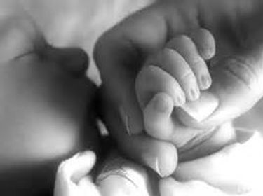 baby hands holding moms hand