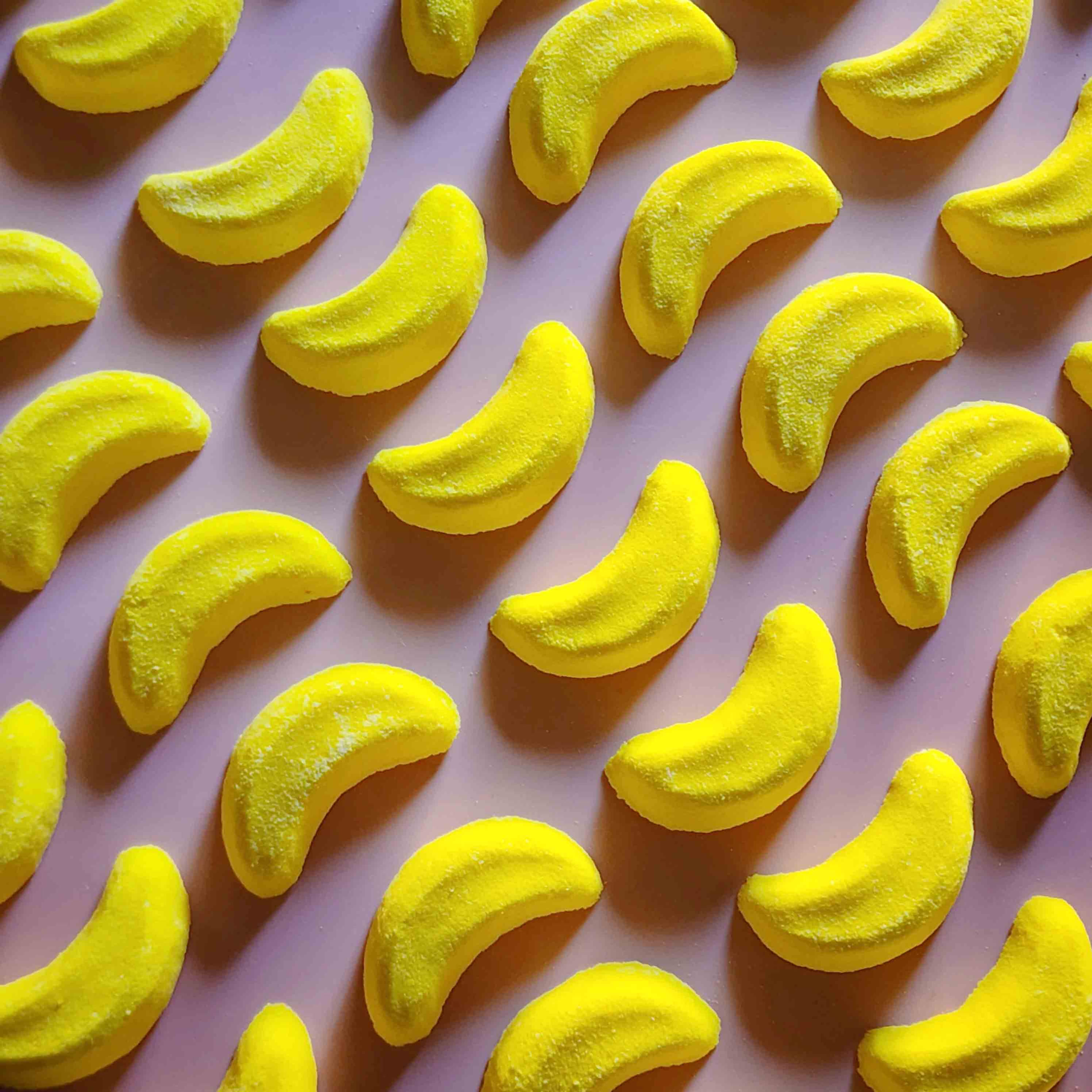 Mini banana shaped bath bomb shaped as iconic australian party mix lolly