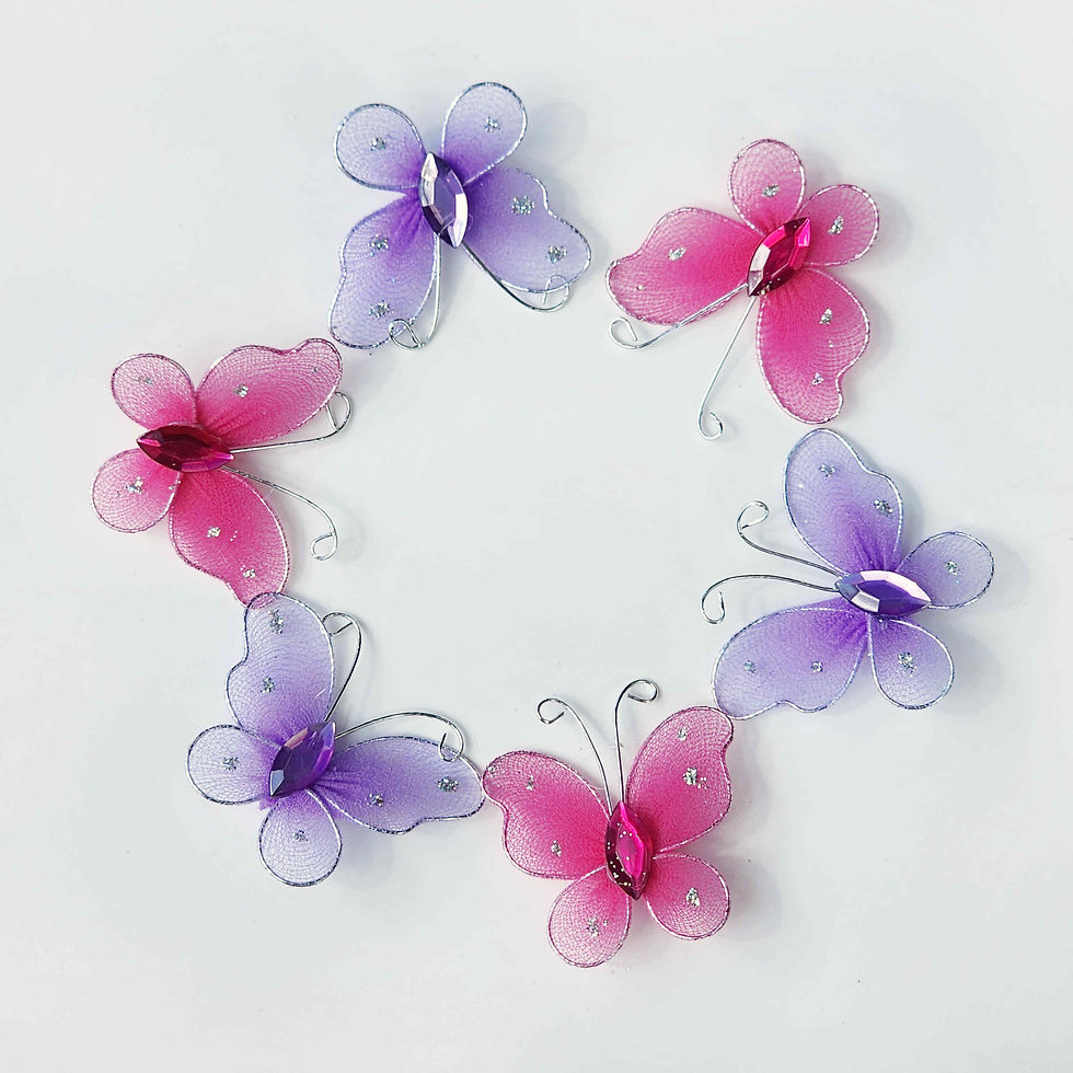 Circle of pink and purple butterflies made of mesh fabric and wire on a white background