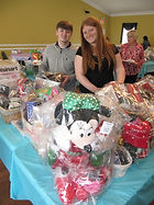 Volunteers setting up for a fundraiser for Adopt A Senior Organization
