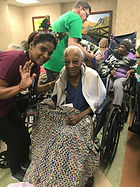 Adopt A Senior volunteers hand out gifts to Seniors