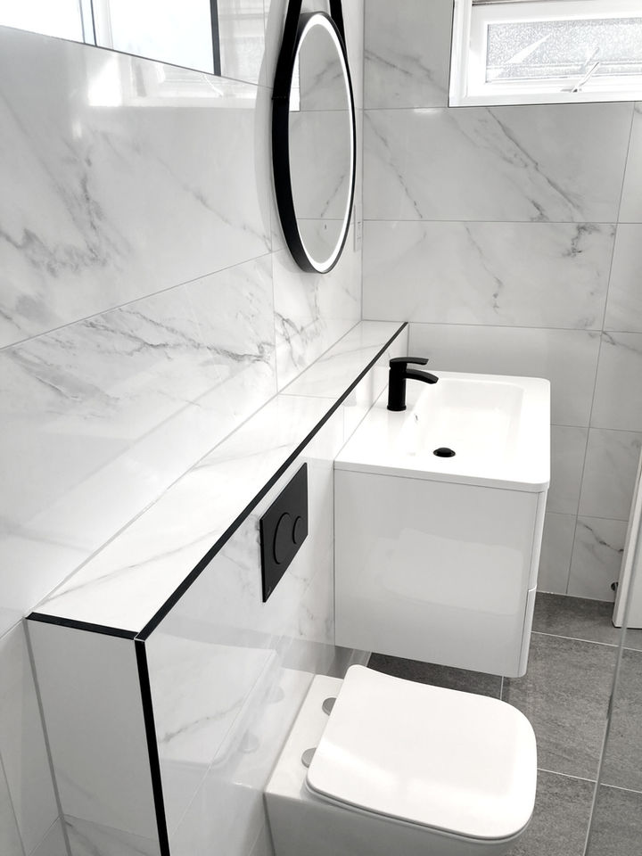 Family bathroom with walk in wet area finished with carrera marble in Morpeth