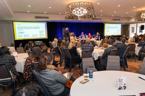 wide shot of stage and audience at a corporate event