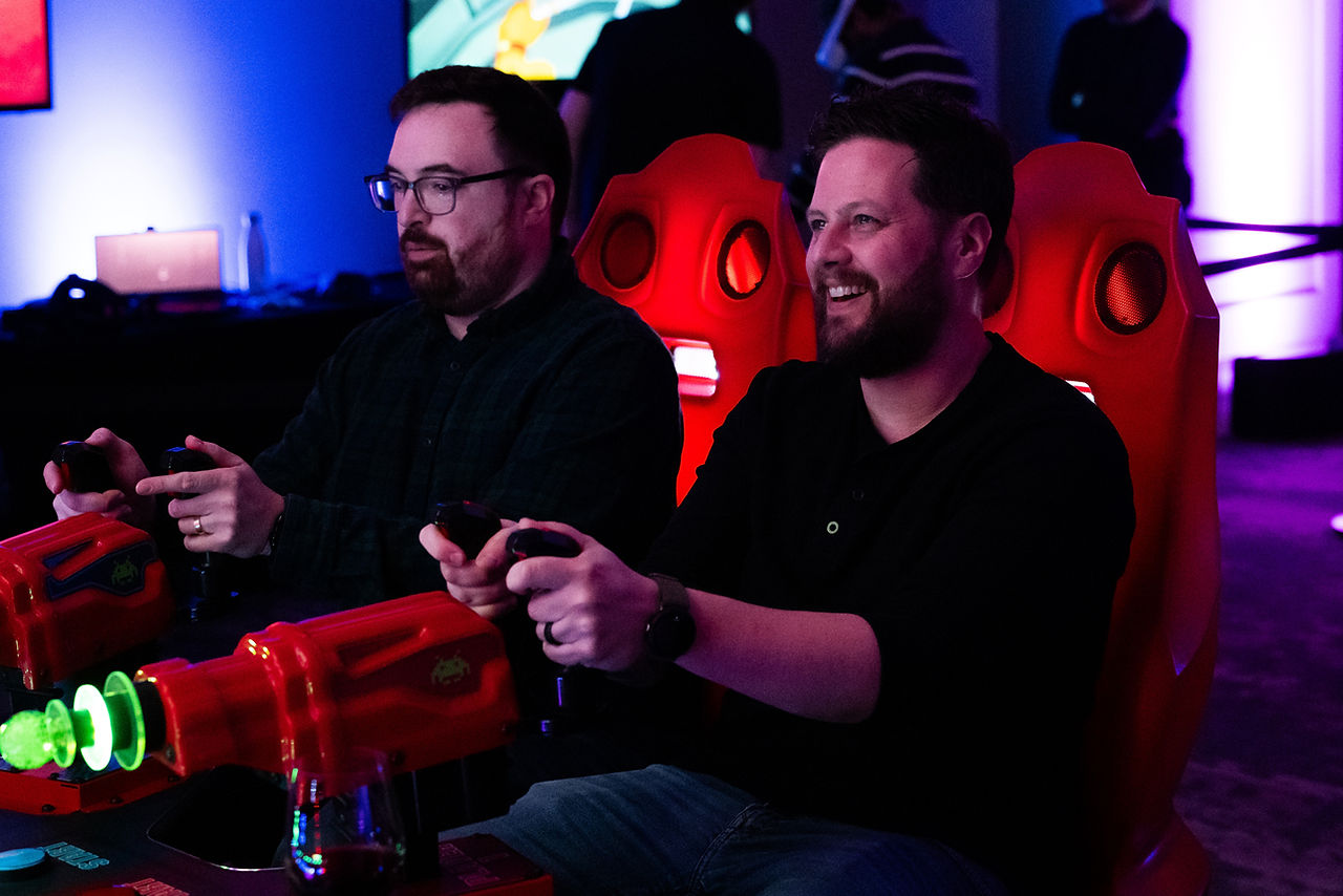 men playing video games at a party